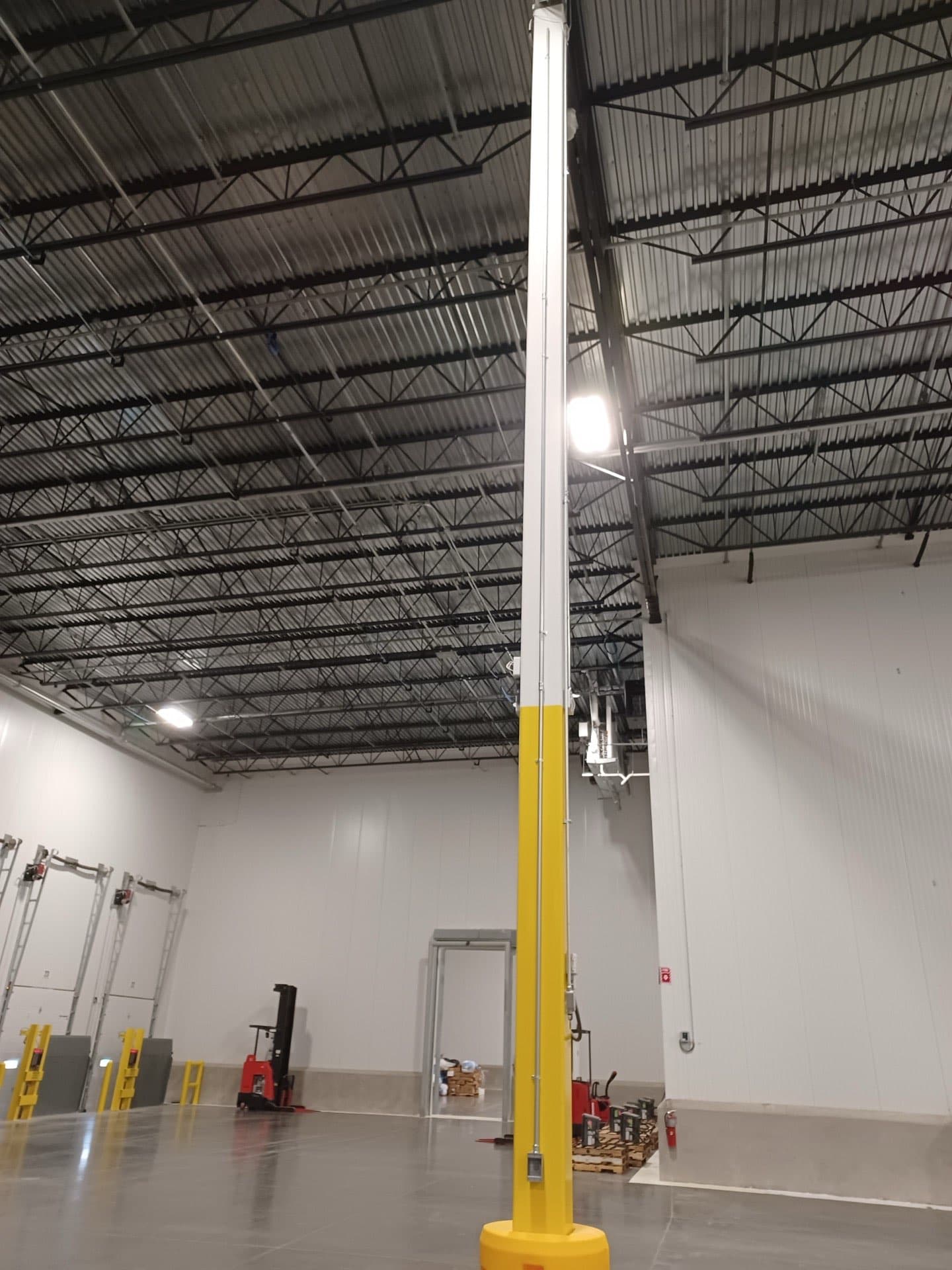 Industrial warehouse with network infrastructure and cable management systems